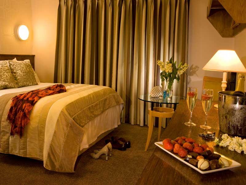 camera da letto al Great National Commons Inn Hotel